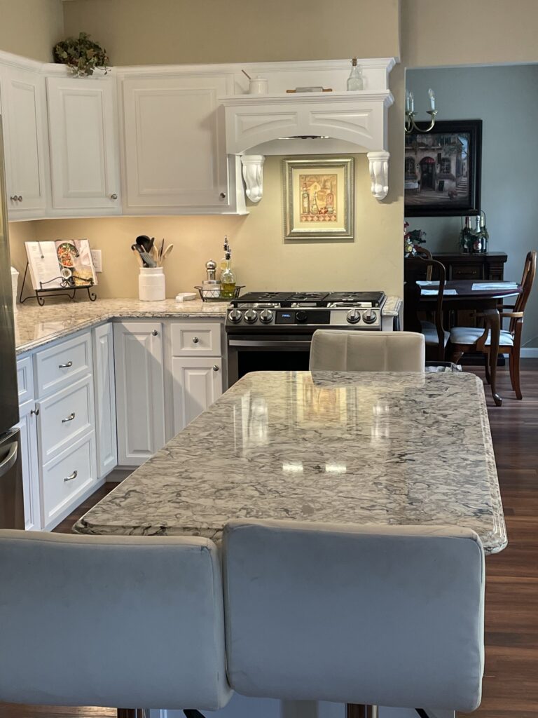 Maple Cabinetry with decorative range hood